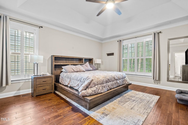 200 Heather Brook Cir, Spring Lake, NC 28390 - bedroom featuring dark wood-type flooring, a raised ceiling, baseboards, and multiple windows