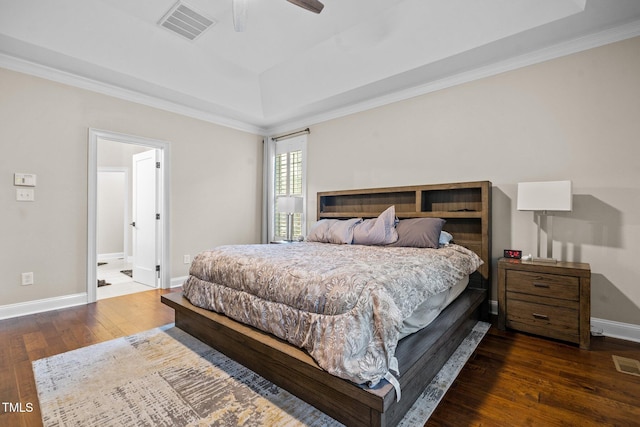 200 Heather Brook Cir, Spring Lake, NC 28390 - bedroom with visible vents, hardwood / wood-style flooring, baseboards, ornamental molding, and a tray ceiling
