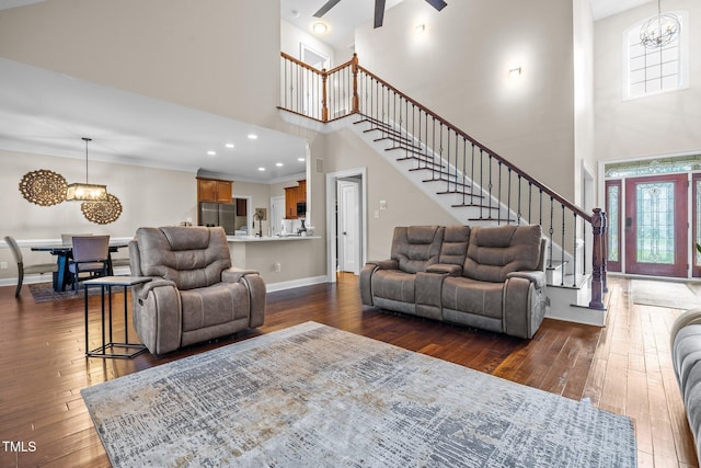 200 Heather Brook Cir, Spring Lake, NC 28390 - living area with plenty of natural light, stairs, dark wood-style flooring, and a high ceiling