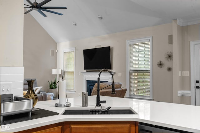 200 Heather Brook Cir, Spring Lake, NC 28390 - kitchen featuring open floor plan, ceiling fan, brown cabinets, a sink, and a wealth of natural light