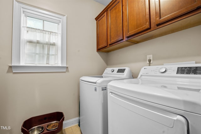 200 Heather Brook Cir, Spring Lake, NC 28390 - laundry area featuring baseboards, tile patterned flooring, cabinet space, and independent washer and dryer