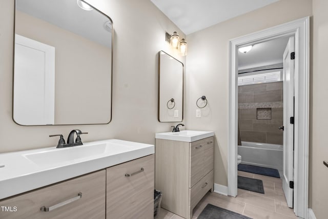 200 Heather Brook Cir, Spring Lake, NC 28390 - bathroom with a sink, tile patterned floors, toilet, and two vanities