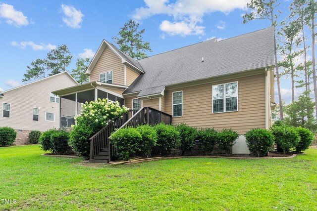 200 Heather Brook Cir, Spring Lake, NC 28390 - rear view of property featuring a lawn, stairs, a sunroom, and roof with shingles