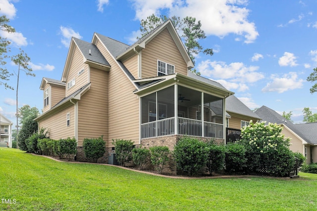 200 Heather Brook Cir, Spring Lake, NC 28390 - view of home's exterior with a lawn, a ceiling fan, a sunroom, and brick siding