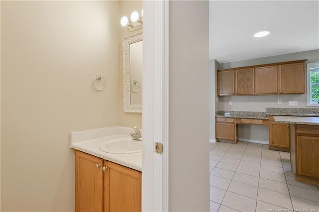 bathroom with tile patterned floors and vanity
