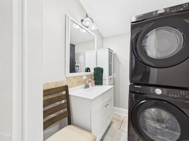 3609 Creekridge Country Rd, Randleman, NC 27317 - laundry room with laundry area, stacked washer and dryer, light tile patterned flooring, baseboards, and a sink