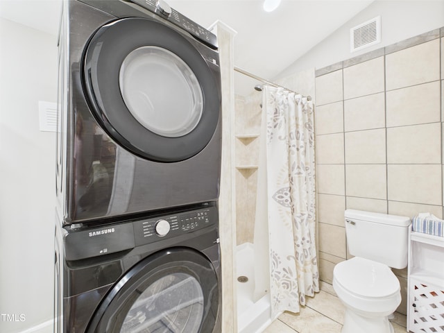 3609 Creekridge Country Rd, Randleman, NC 27317 - full bath with visible vents, stacked washer and clothes dryer, lofted ceiling, toilet, and a shower stall