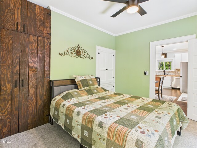 3609 Creekridge Country Rd, Randleman, NC 27317 - bedroom with crown molding, freestanding refrigerator, ceiling fan, a sink, and carpet