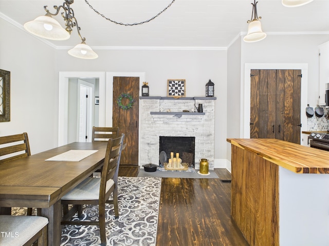 3609 Creekridge Country Rd, Randleman, NC 27317 - dining space featuring baseboards, ornamental molding, a fireplace, and wood finished floors