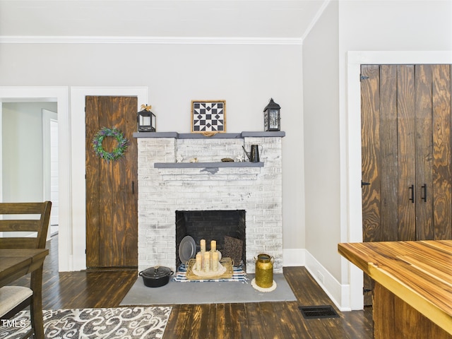 3609 Creekridge Country Rd, Randleman, NC 27317 - living area with visible vents, a brick fireplace, wood finished floors, baseboards, and ornamental molding
