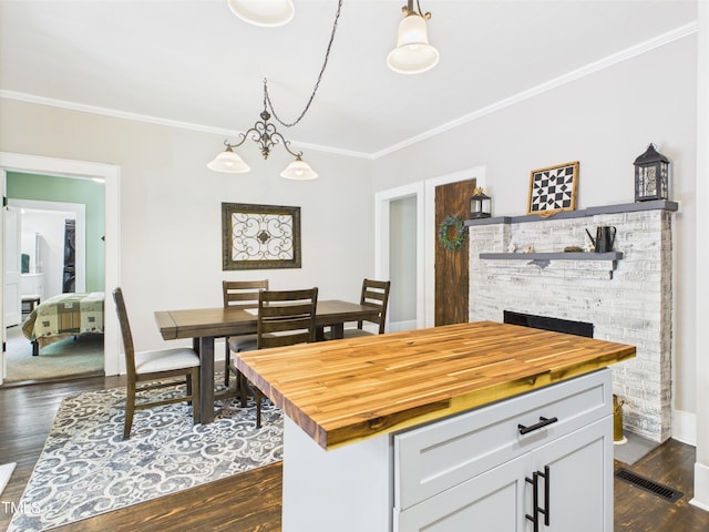 3609 Creekridge Country Rd, Randleman, NC 27317 - kitchen with wooden counters, visible vents, crown molding, dark wood finished floors, and white cabinets