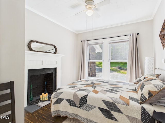 3609 Creekridge Country Rd, Randleman, NC 27317 - bedroom with crown molding, a fireplace with flush hearth, a ceiling fan, and wood finished floors
