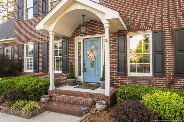entrance to property with brick siding