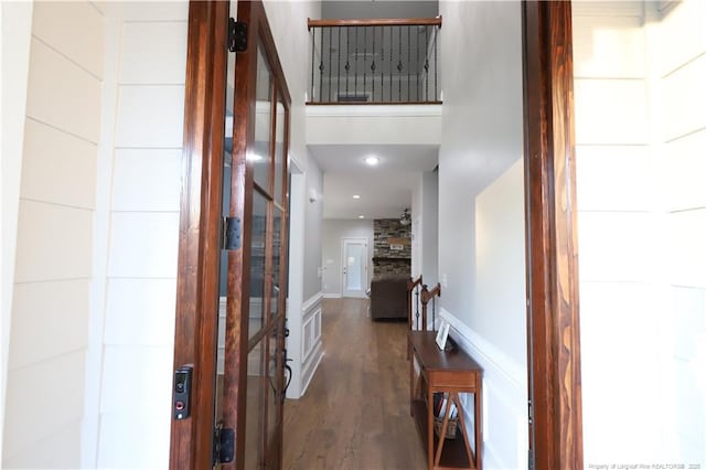 interior space with baseboards, recessed lighting, and wood finished floors