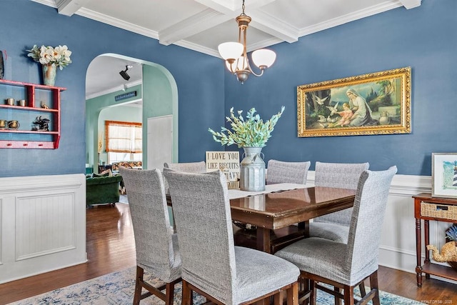 6628 Carriage Crossing Rd, Hope Mills, NC 28348 - dining area with beam ceiling, arched walkways, wood finished floors, ornamental molding, and coffered ceiling