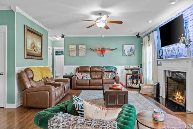 6628 Carriage Crossing Rd, Hope Mills, NC 28348 - living room with crown molding, a ceiling fan, a fireplace with flush hearth, and wood finished floors