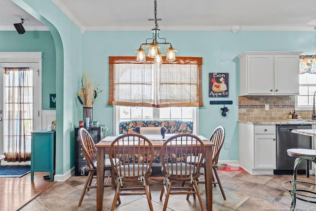 6628 Carriage Crossing Rd, Hope Mills, NC 28348 - dining area with arched walkways, a notable chandelier, and ornamental molding