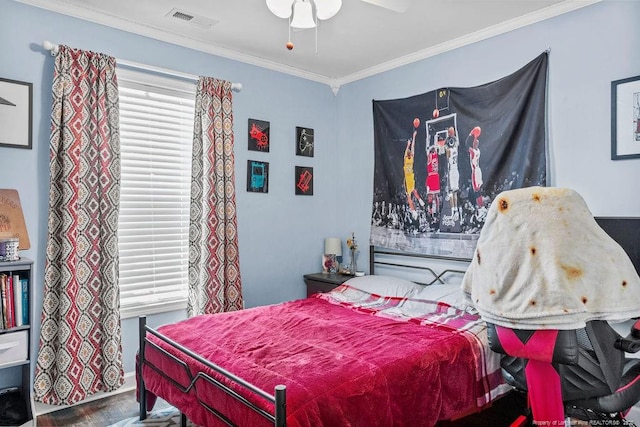 6628 Carriage Crossing Rd, Hope Mills, NC 28348 - bedroom featuring a ceiling fan, visible vents, crown molding, wood finished floors, and baseboards