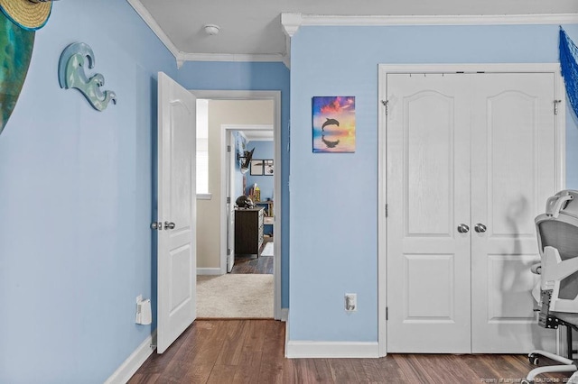 6628 Carriage Crossing Rd, Hope Mills, NC 28348 - bedroom with crown molding, dark wood-style flooring, baseboards, and a closet