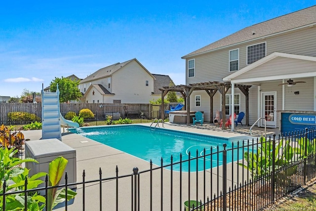 6628 Carriage Crossing Rd, Hope Mills, NC 28348 - view of swimming pool featuring ceiling fan, a pergola, a fenced backyard, a hot tub, and a water slide