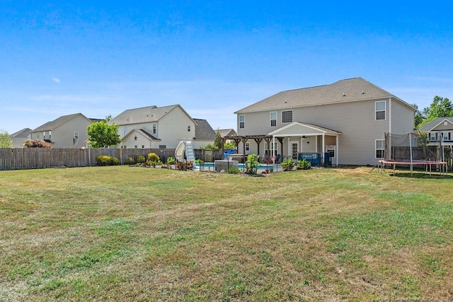 6628 Carriage Crossing Rd, Hope Mills, NC 28348 - view of yard featuring a fenced backyard, a fenced in pool, a patio area, a trampoline, and a residential view