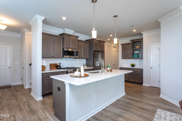 228 Shingle Oak Rd, Wake Forest, NC 27587 - kitchen featuring stainless steel appliances, a sink, open shelves, tasteful backsplash, and light countertops