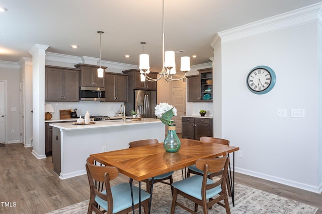 228 Shingle Oak Rd, Wake Forest, NC 27587 - dining room with wood finished floors, baseboards, crown molding, and recessed lighting