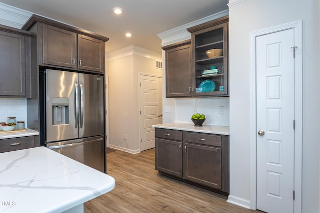 228 Shingle Oak Rd, Wake Forest, NC 27587 - kitchen featuring stainless steel fridge with ice dispenser, dark brown cabinetry, tasteful backsplash, and recessed lighting