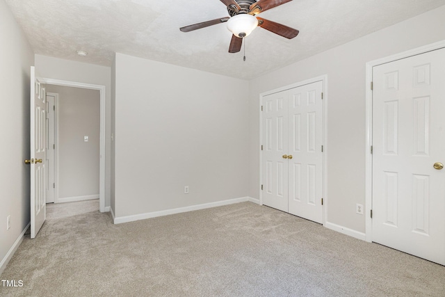 2919 Hayfield Rd, Wade, NC 28395 - unfurnished bedroom with light carpet, baseboards, a ceiling fan, and a closet