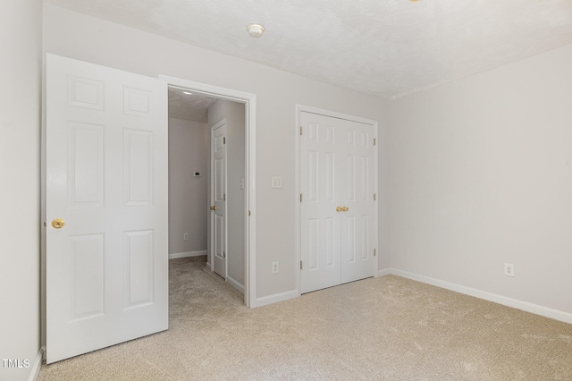 2919 Hayfield Rd, Wade, NC 28395 - unfurnished bedroom with light colored carpet, a closet, and baseboards