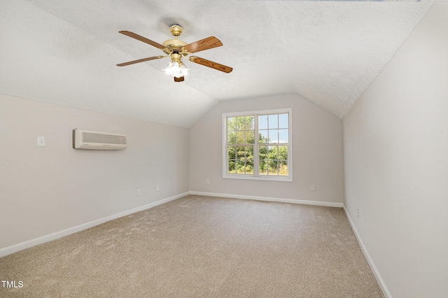 2919 Hayfield Rd, Wade, NC 28395 - bonus room featuring a textured ceiling, baseboards, light colored carpet, lofted ceiling, and an AC wall unit