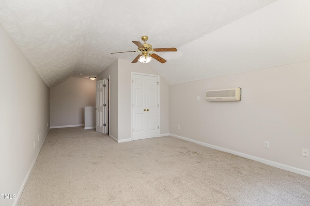 2919 Hayfield Rd, Wade, NC 28395 - additional living space featuring vaulted ceiling, ceiling fan, light carpet, and a wall mounted AC