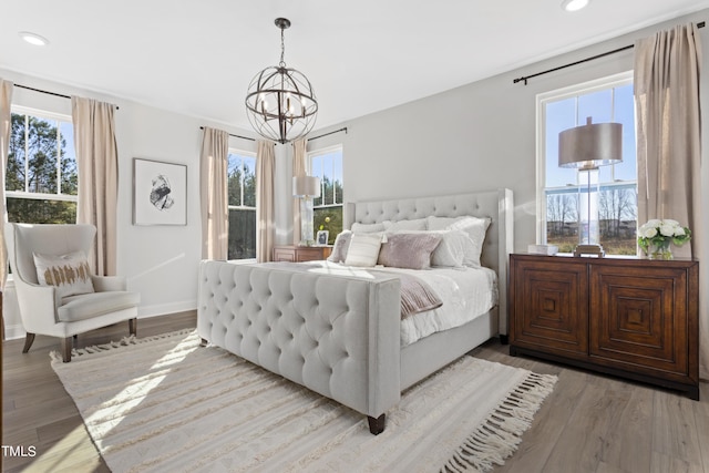 214 Alden Way, Angier, NC 27501 - bedroom featuring recessed lighting, light wood finished floors, baseboards, and a chandelier
