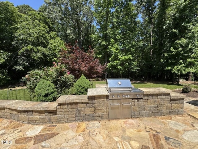 view of patio with area for grilling and grilling area