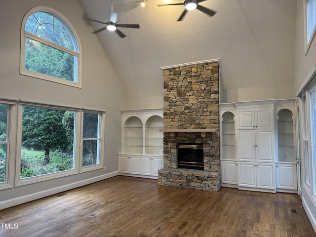 90021 Hoey, Chapel Hill, NC 27517 - unfurnished living room with high vaulted ceiling, ceiling fan, dark wood-type flooring, a fireplace, and built in features