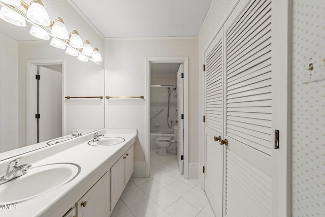 full bath featuring a sink, toilet, a closet, and tile patterned floors