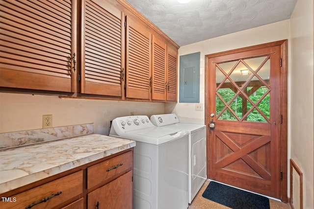 washroom featuring cabinet space, washing machine and dryer, electric panel, and light carpet