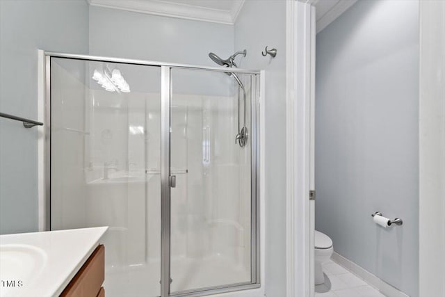 bathroom featuring vanity, ornamental molding, a shower stall, and toilet