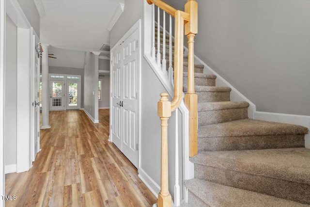 stairway with baseboards and wood finished floors