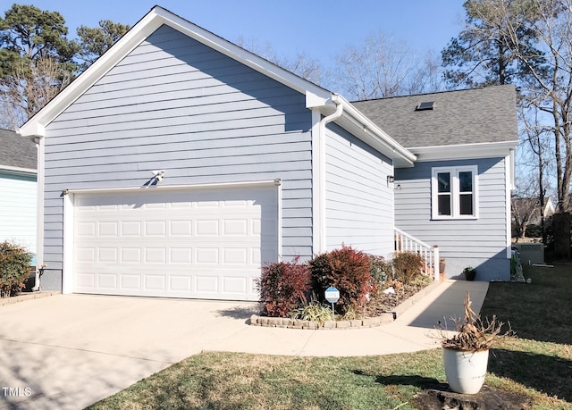 1944 Castle Pines Dr, Raleigh, NC 27604 - view of home's exterior with concrete driveway, a shingled roof, and an attached garage