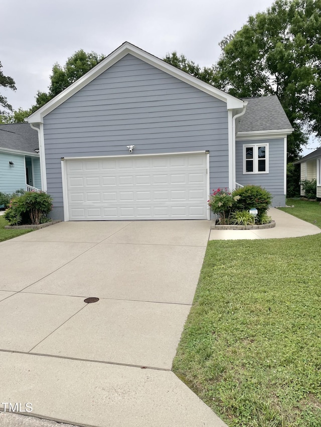 1944 Castle Pines Dr, Raleigh, NC 27604 - ranch-style home with driveway, an attached garage, and a front yard