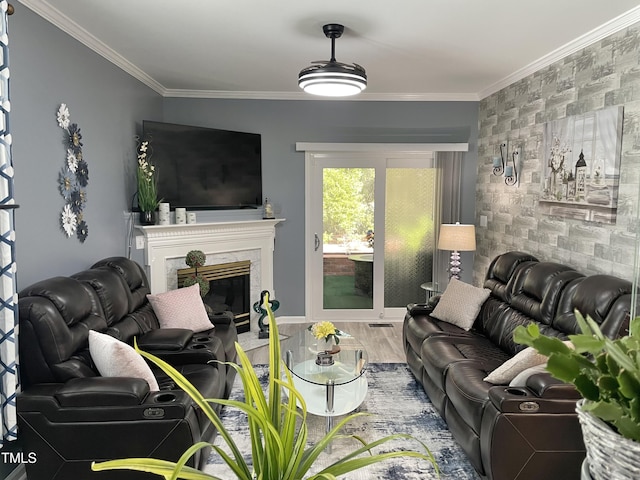 1944 Castle Pines Dr, Raleigh, NC 27604 - living area featuring an accent wall, ornamental molding, a high end fireplace, and wood finished floors