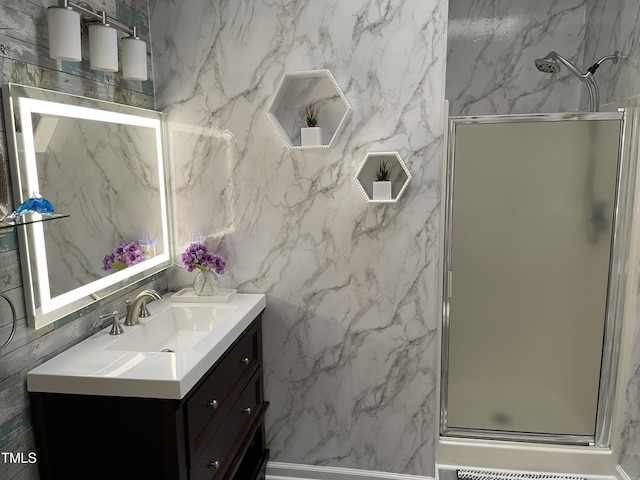 1944 Castle Pines Dr, Raleigh, NC 27604 - bathroom with vanity, a shower stall, and tile walls