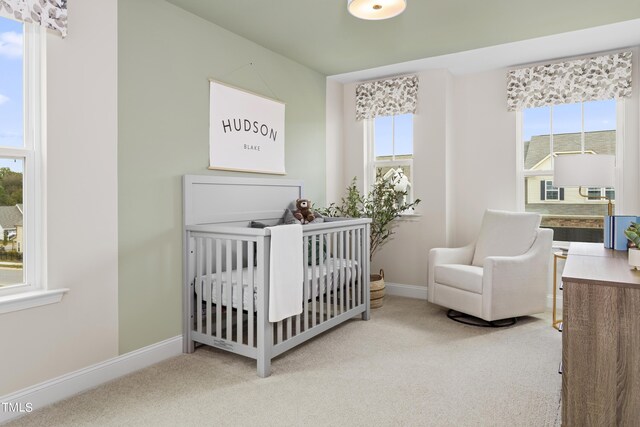 48 Honeydew Way, Clayton, NC 27520 - bedroom with carpet floors, baseboards, and a nursery area