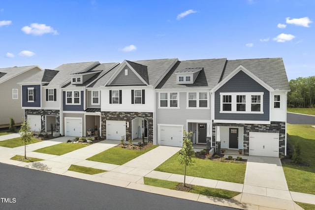 44 Honeydew Way, Clayton, NC 27520 - townhome / multi-family property featuring a garage, driveway, stone siding, and a front lawn