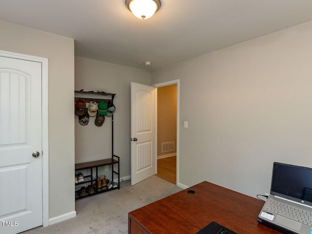 office with carpet flooring, baseboards, and visible vents