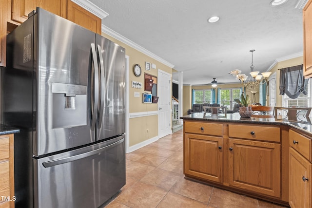 kitchen with crown molding, brown cabinets, and stainless steel fridge with ice dispenser