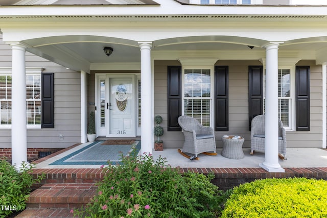 doorway to property with covered porch