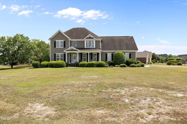 view of front facade featuring covered porch and a front yard