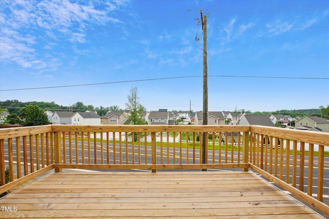 wooden terrace featuring a residential view